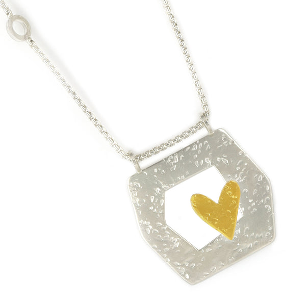 framed heart silver and gold necklace close up by maria blondet
